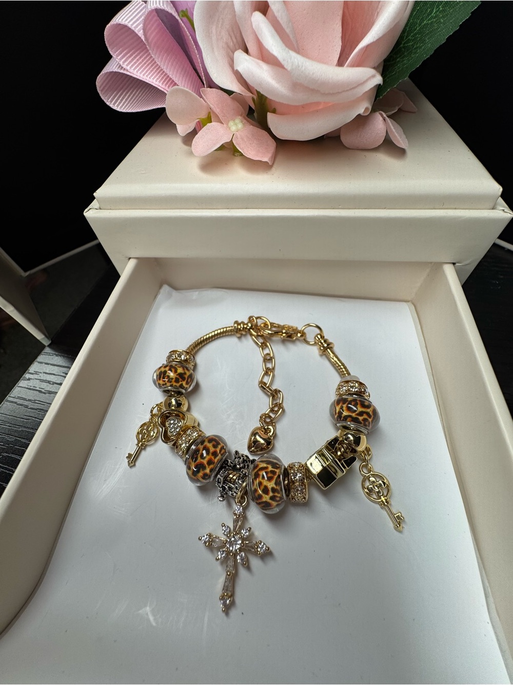 Gold Charm Bracelet with Leopard Beads and Cross Charm - Pink Accents